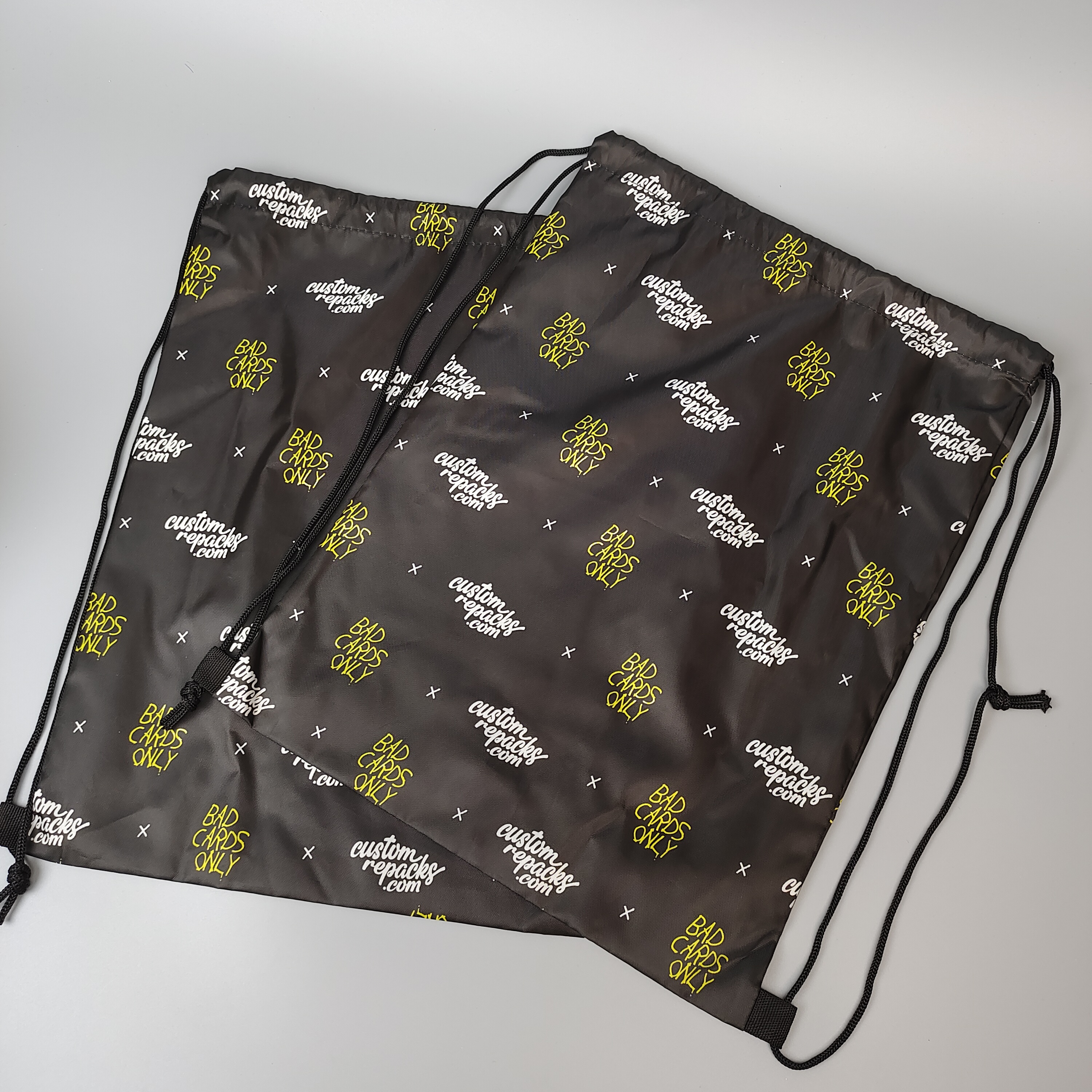 black polyester drawstring backpack with repeated all-over logo pattern - view 3