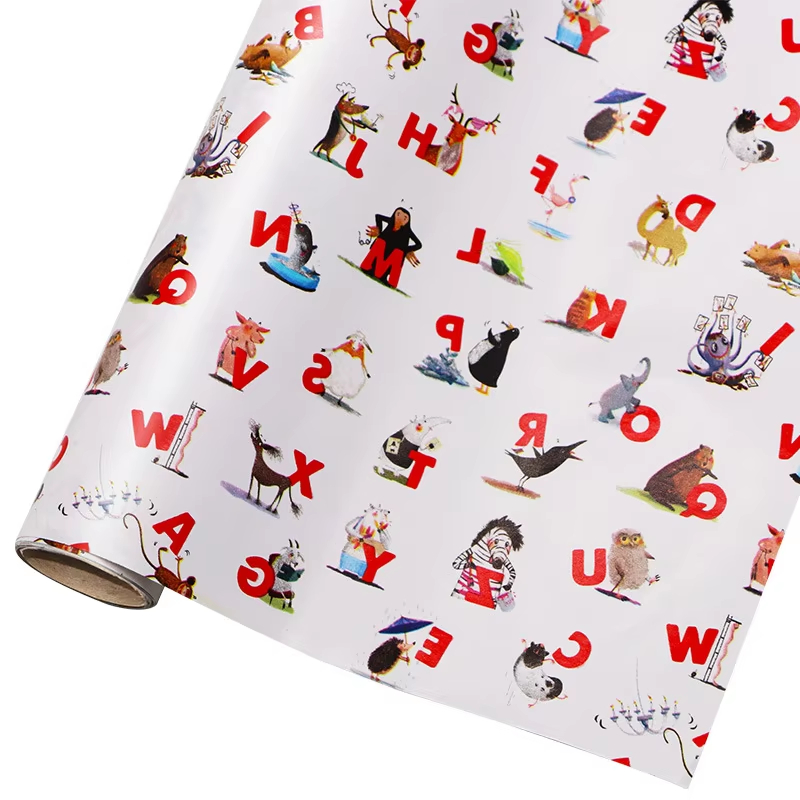white wrapping paper with colorful alphabet and animal pattern