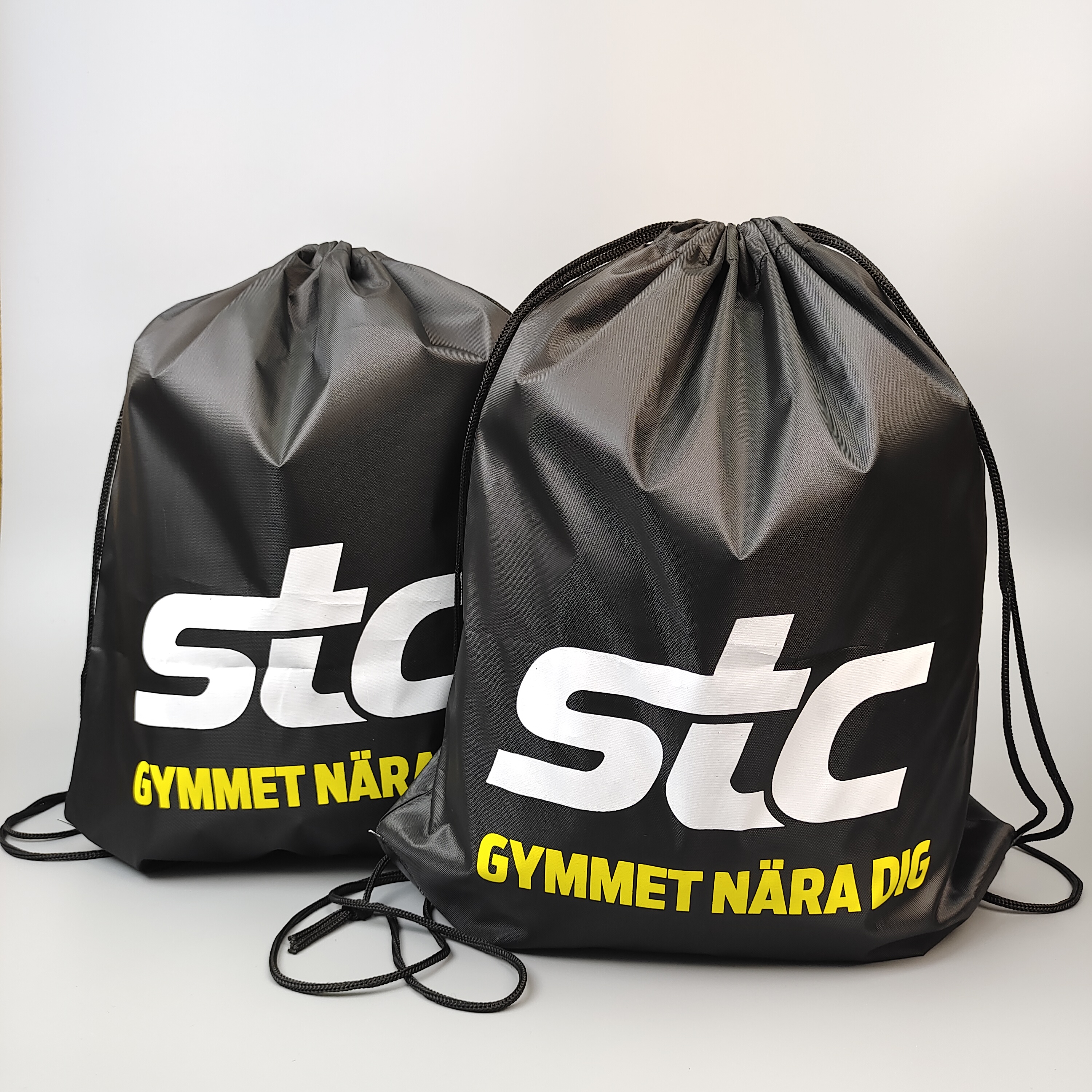 black polyester drawstring backpack with large white printed logo - view 2
