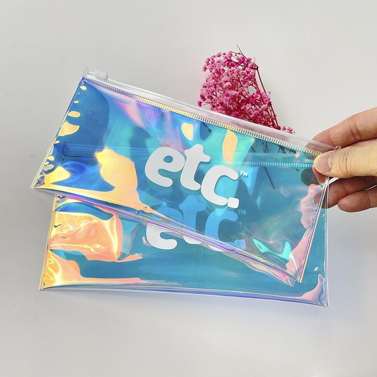 blue holographic PVC cosmetic pouch with white slider and printed logo