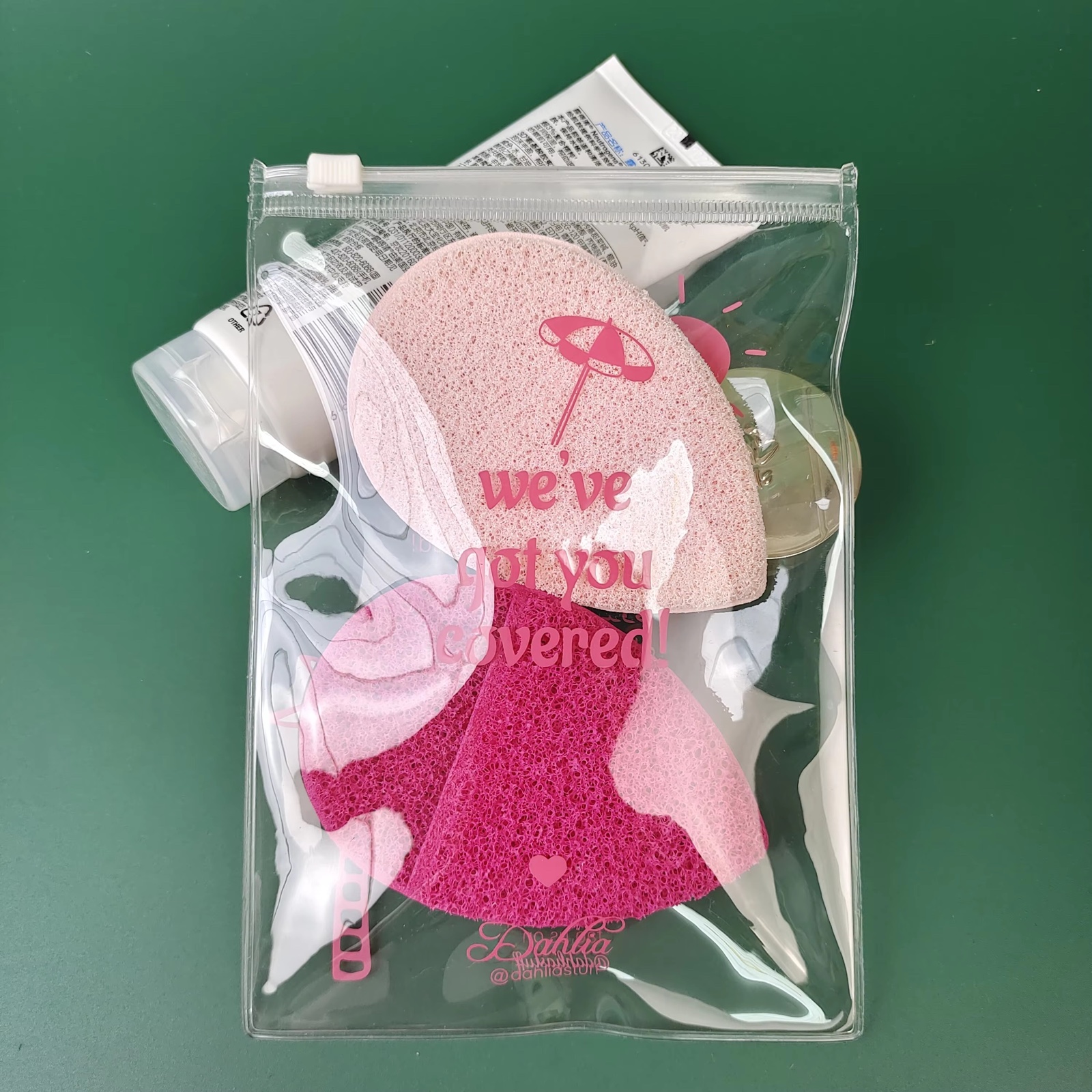 clear PVC slider pouch holding pink beauty sponges and accessories - view 3