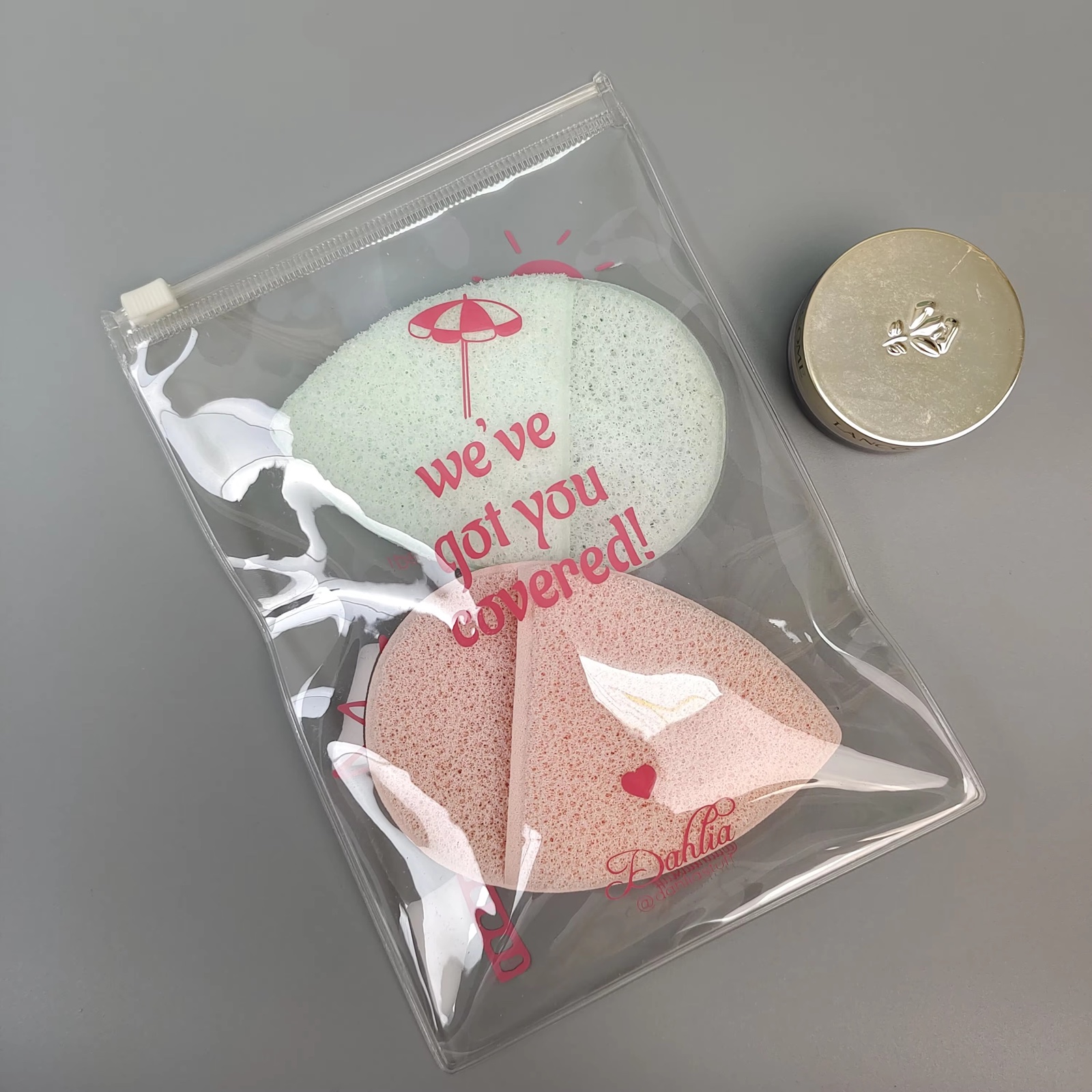 clear PVC slider pouch holding pink beauty sponges and accessories - view 4