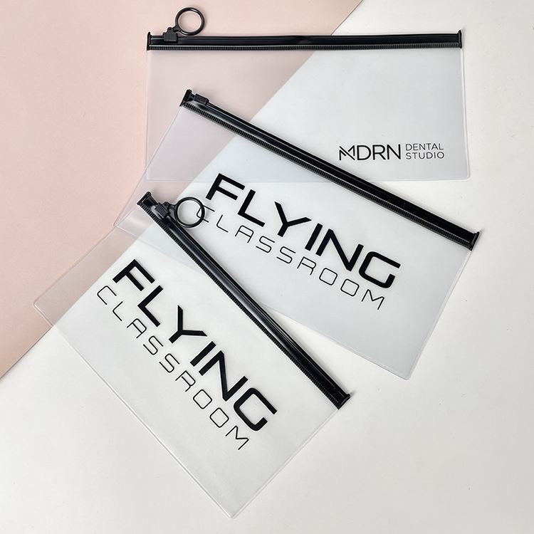 clear PVC cosmetic pouch set with black ring pull zippers and logo printing - view 1