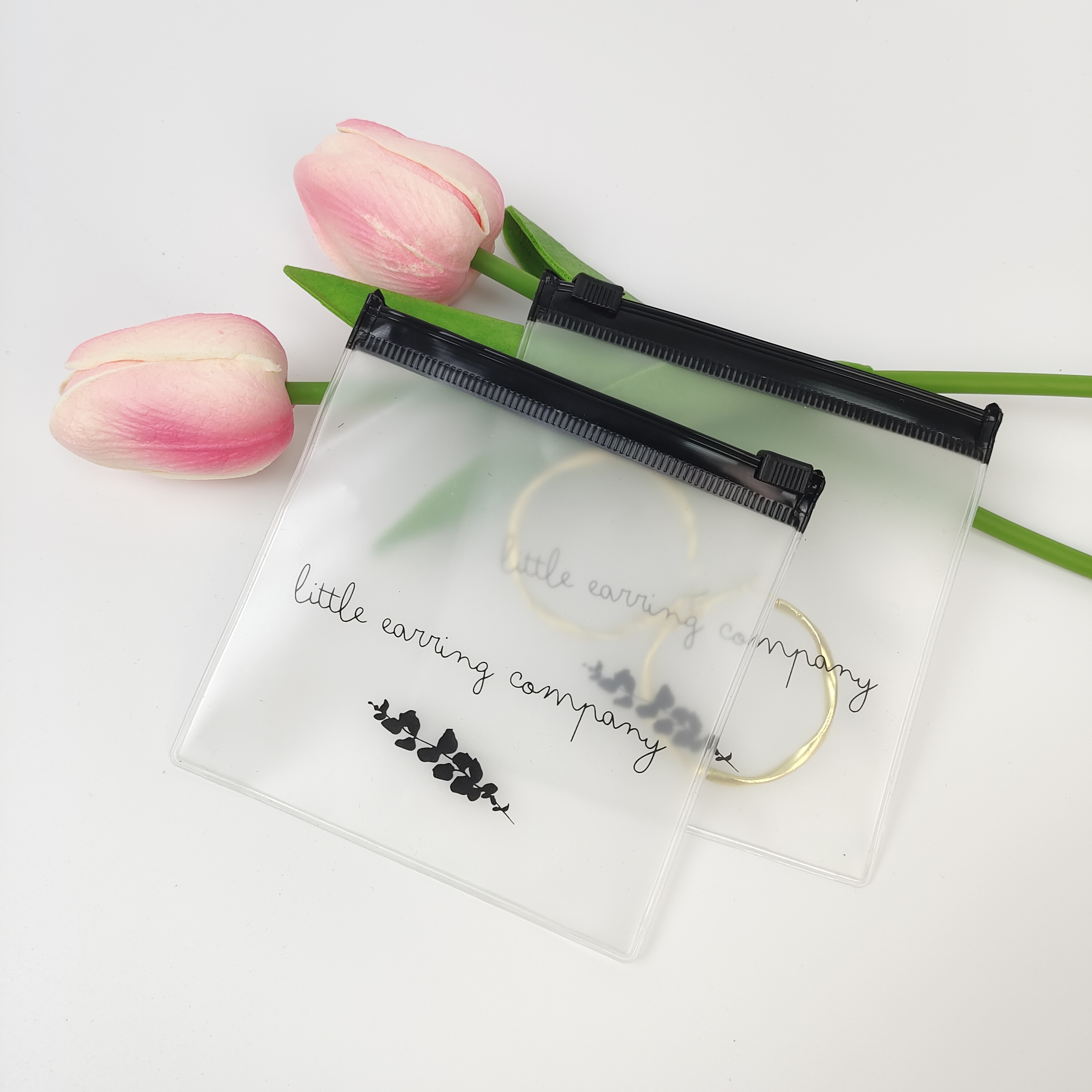 small clear PVC zipper pouch displaying earrings - view 6