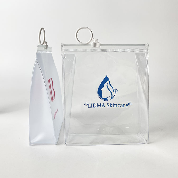 clear PVC skincare pouch with white circular ring pull and blue logo - view 3