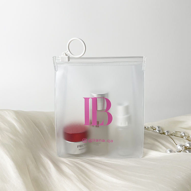 clear PVC skincare pouch with white circular ring pull and blue logo - view 4