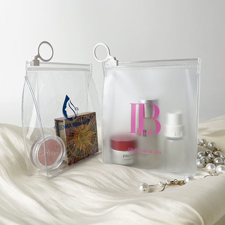 clear PVC skincare pouch with white circular ring pull and blue logo - view 6