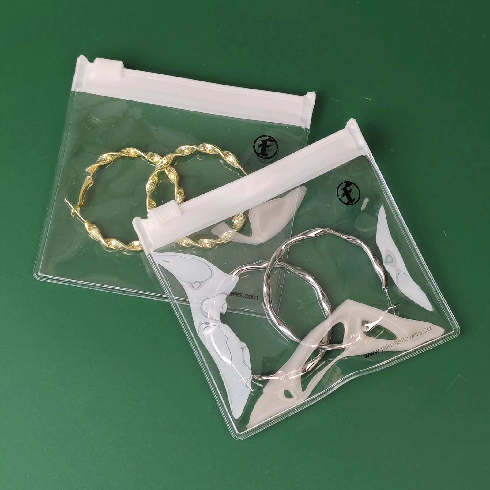 clear PVC jewelry pouches with white zipper and printed black logo - view 4