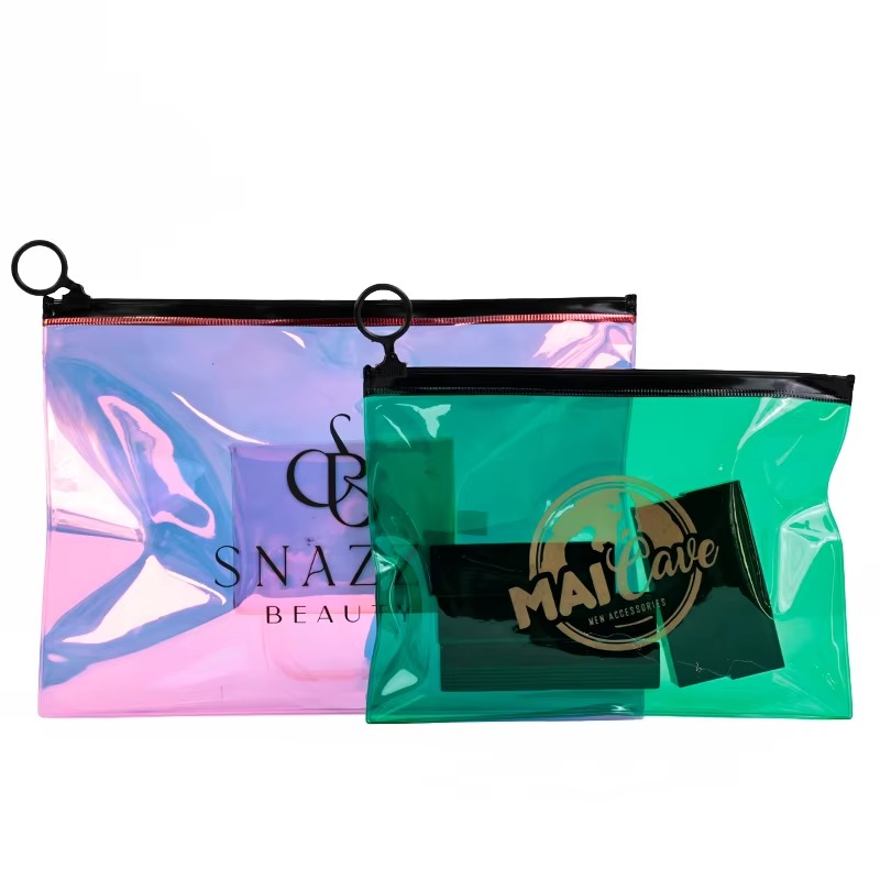 pink and green transparent PVC zipper pouch set with black ring pulls - view 1