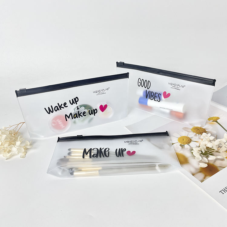 frosted PVC makeup pouch set with black slider closures and printed messages - view 2