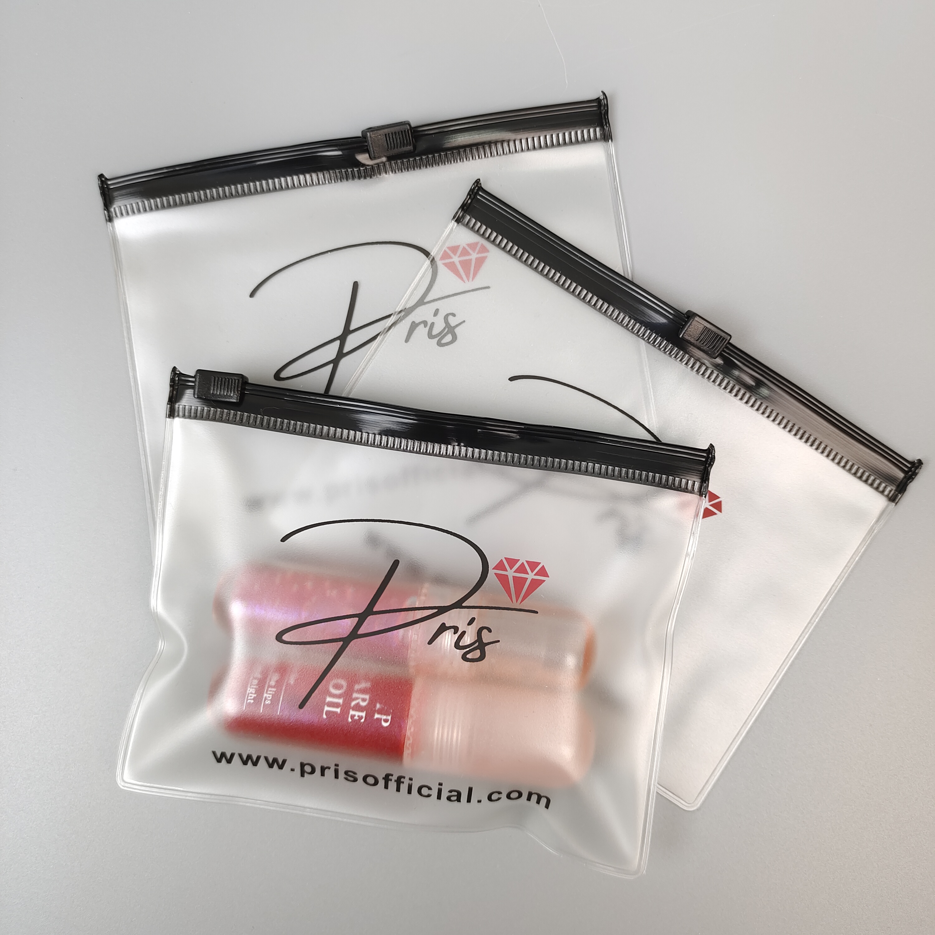frosted PVC zipper pouch holding cosmetic bottles - view 3