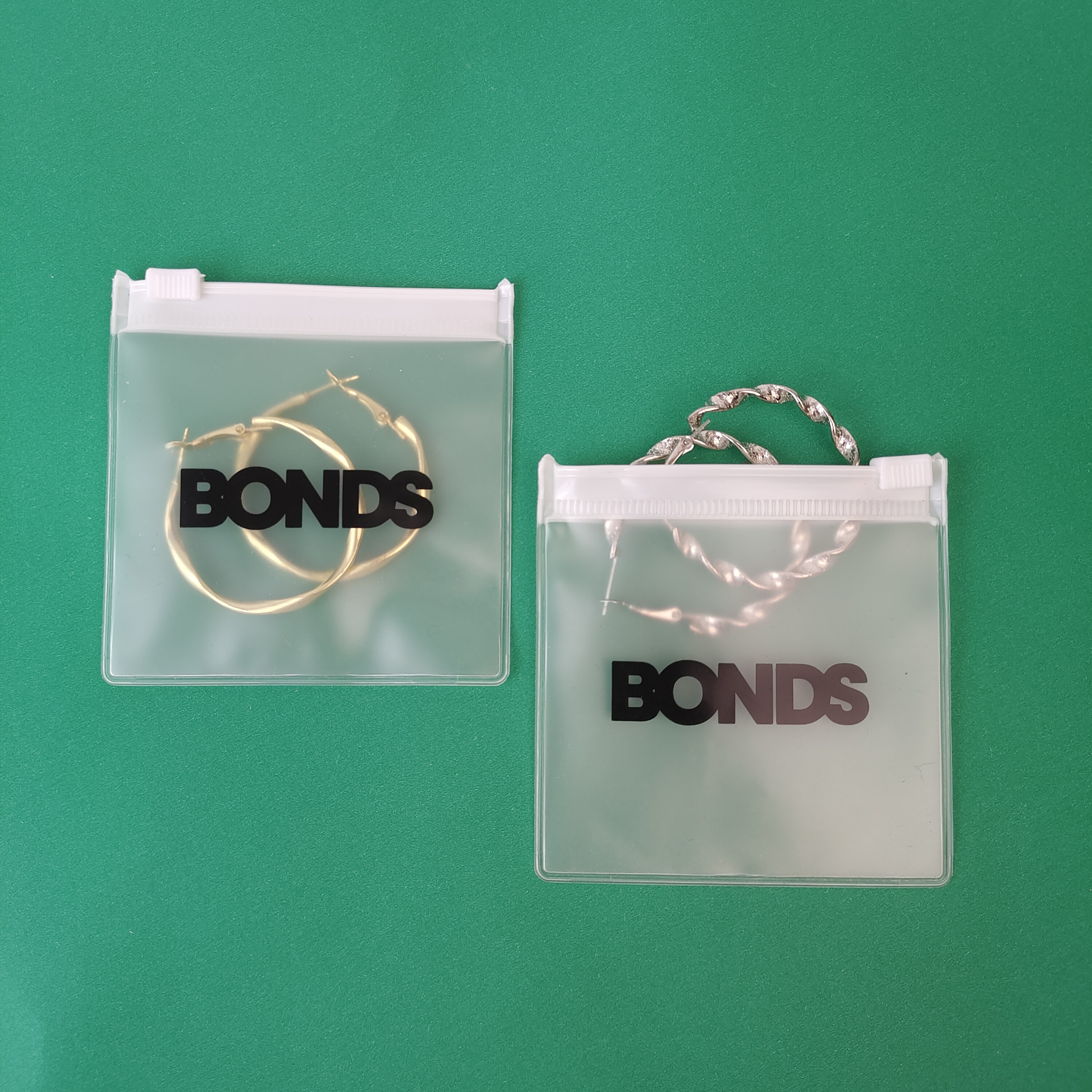 frosted PVC zipper pouch displaying earrings - view 4