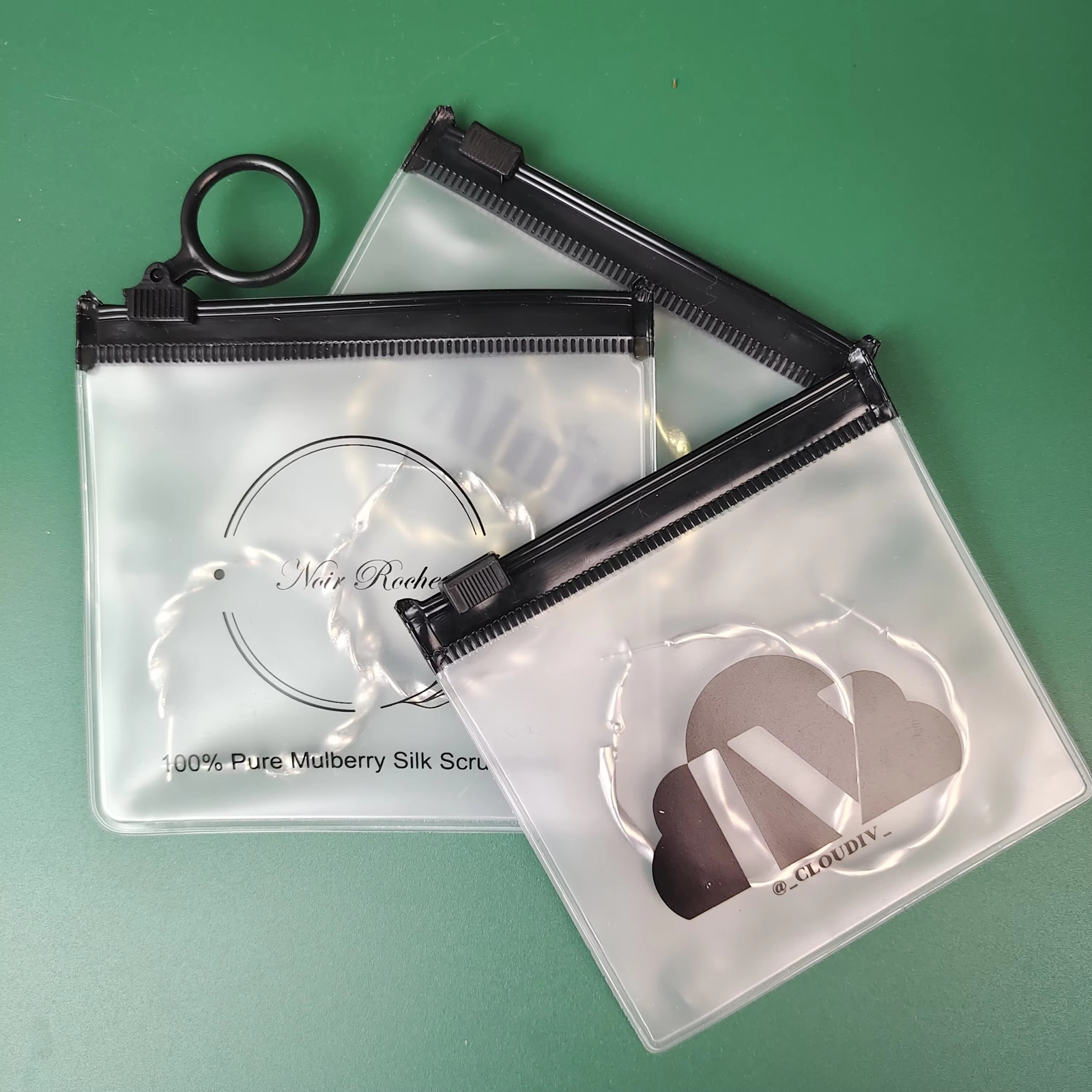frosted PVC ring pull pouch containing jewelry and hair accessories