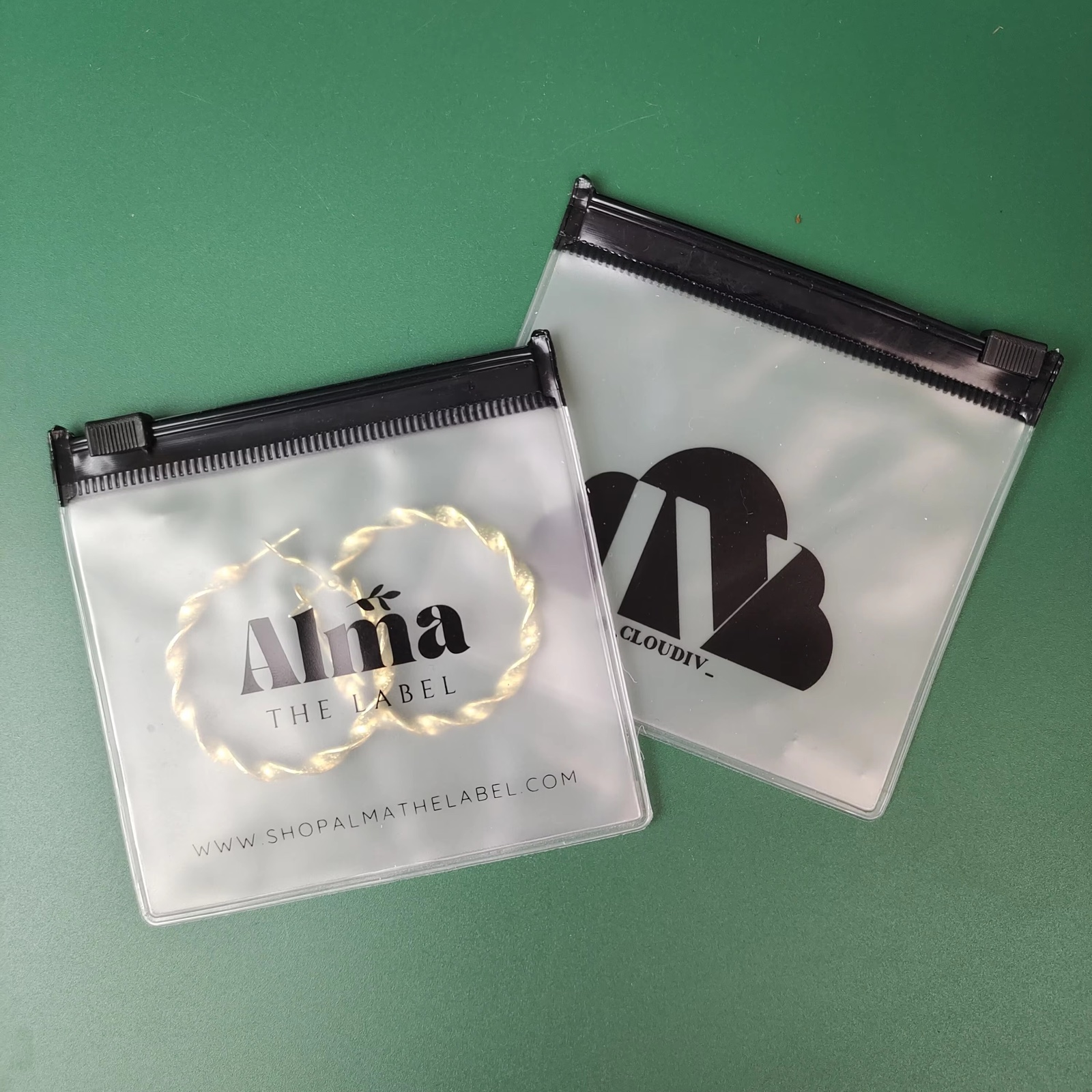 frosted PVC ring pull pouch containing jewelry and hair accessories - view 3