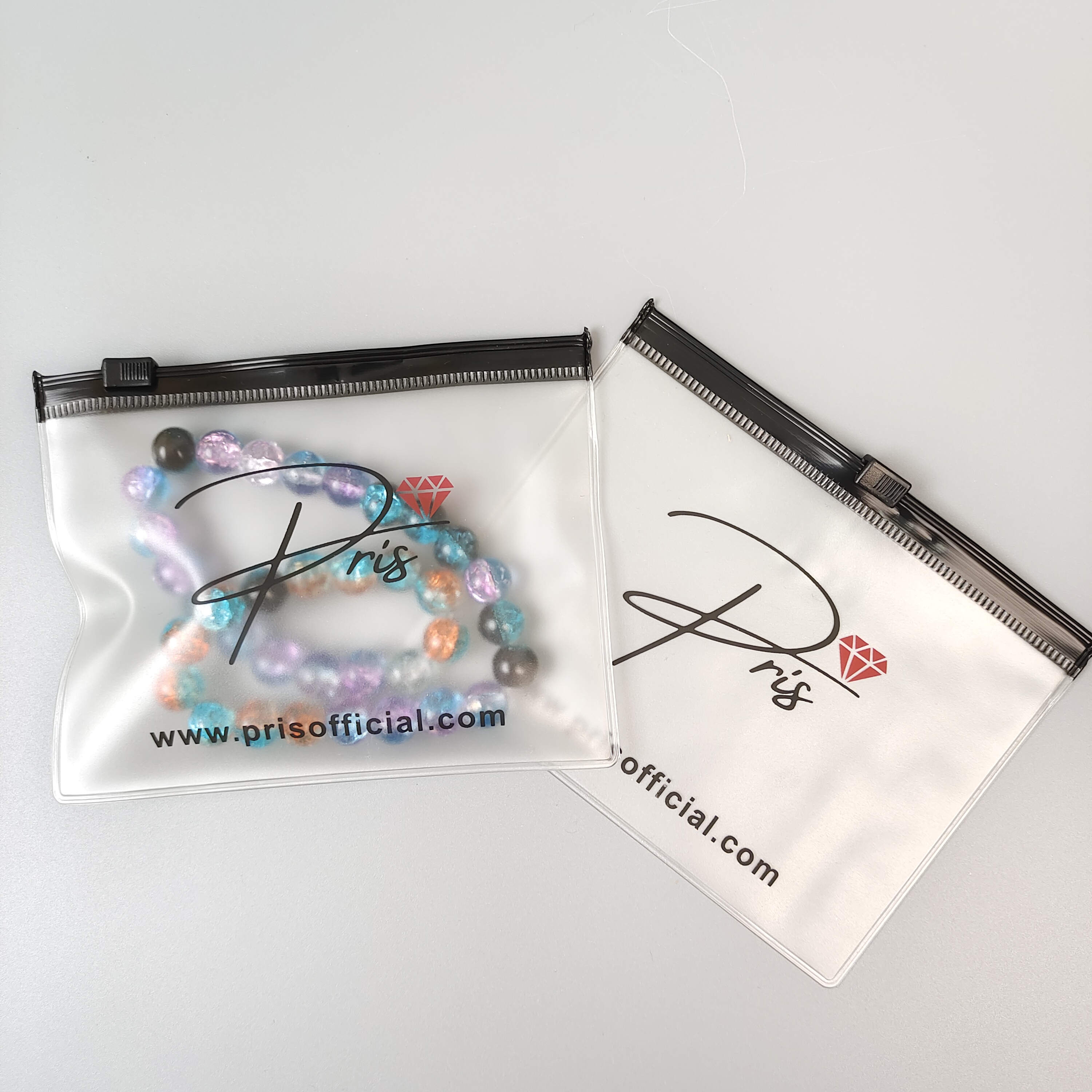 frosted printed PVC zipper bag displaying jewelry