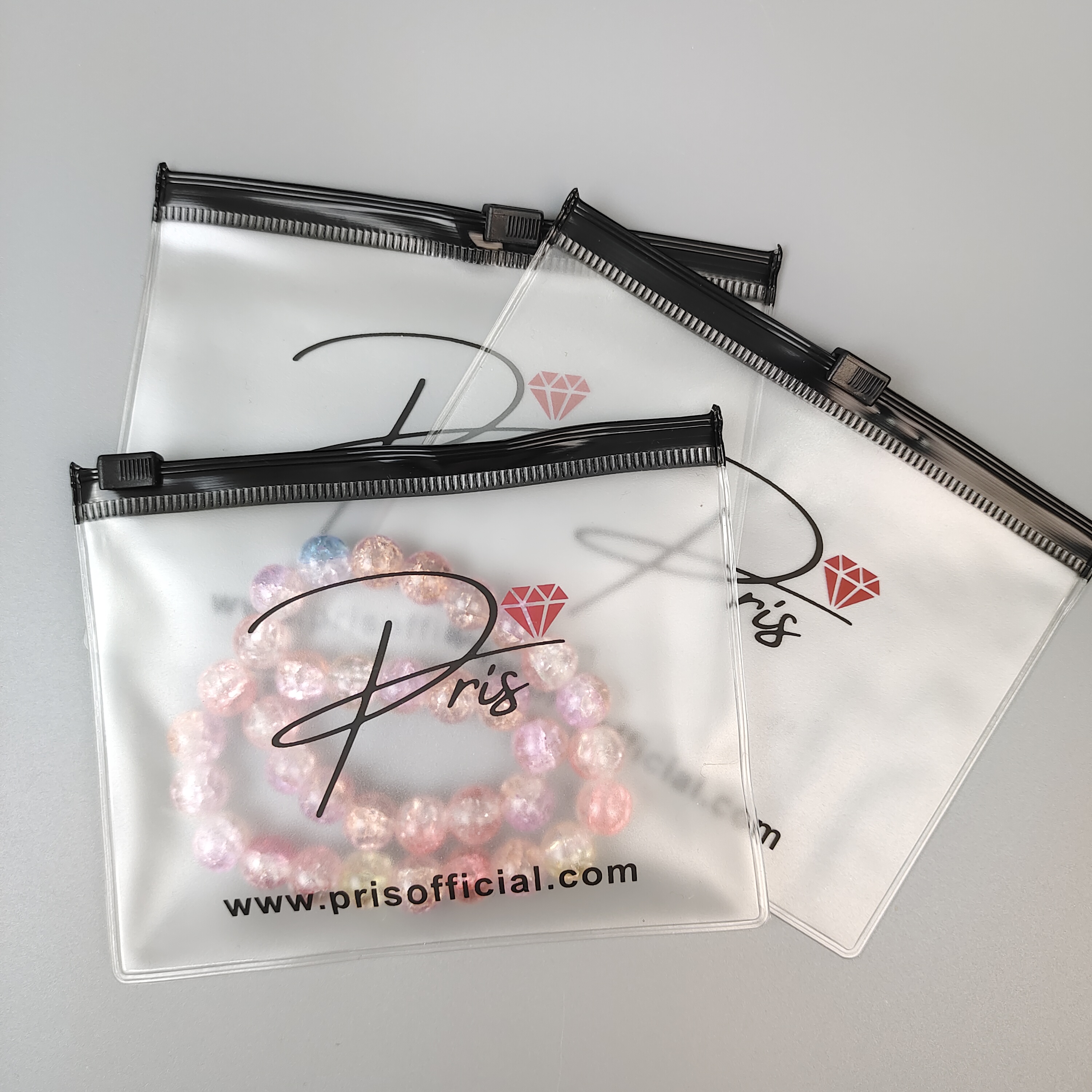 frosted printed PVC zipper bag displaying jewelry - view 2