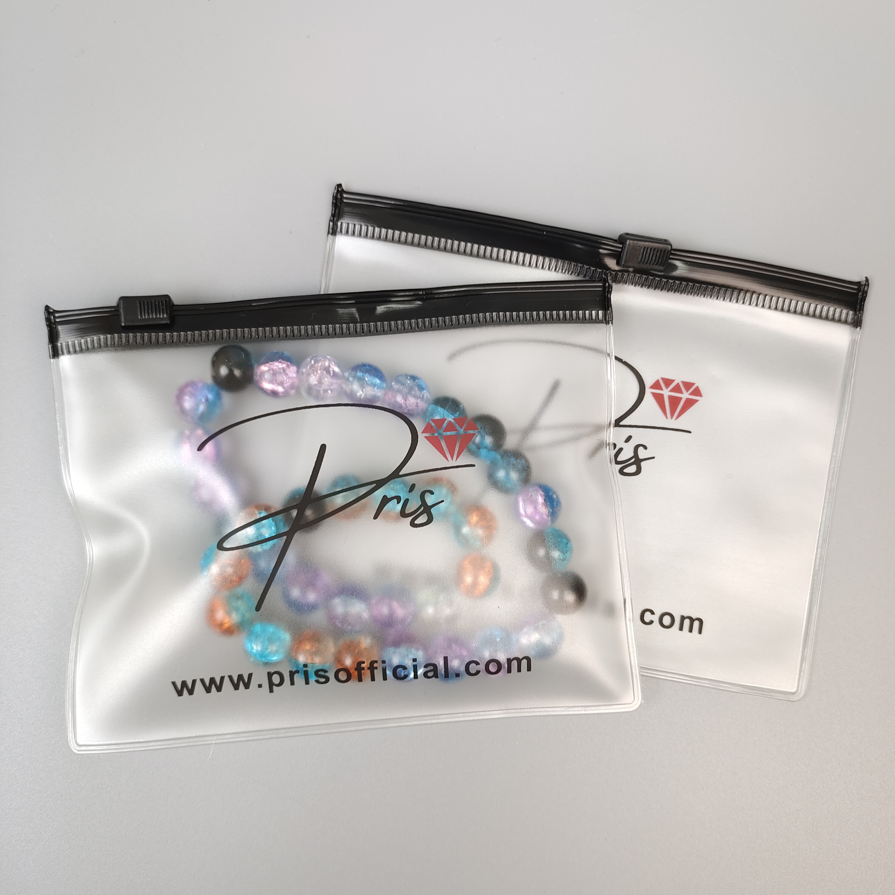 frosted printed PVC zipper bag displaying jewelry - view 4