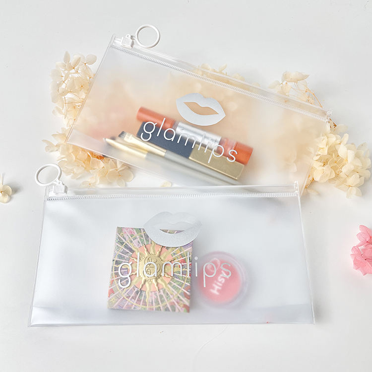 frosted PVC cosmetic pouch with white ring pull and silver logo - view 1
