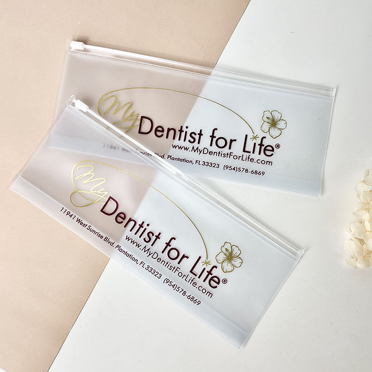 slim frosted PVC toothbrush pouch with white slider and dental print