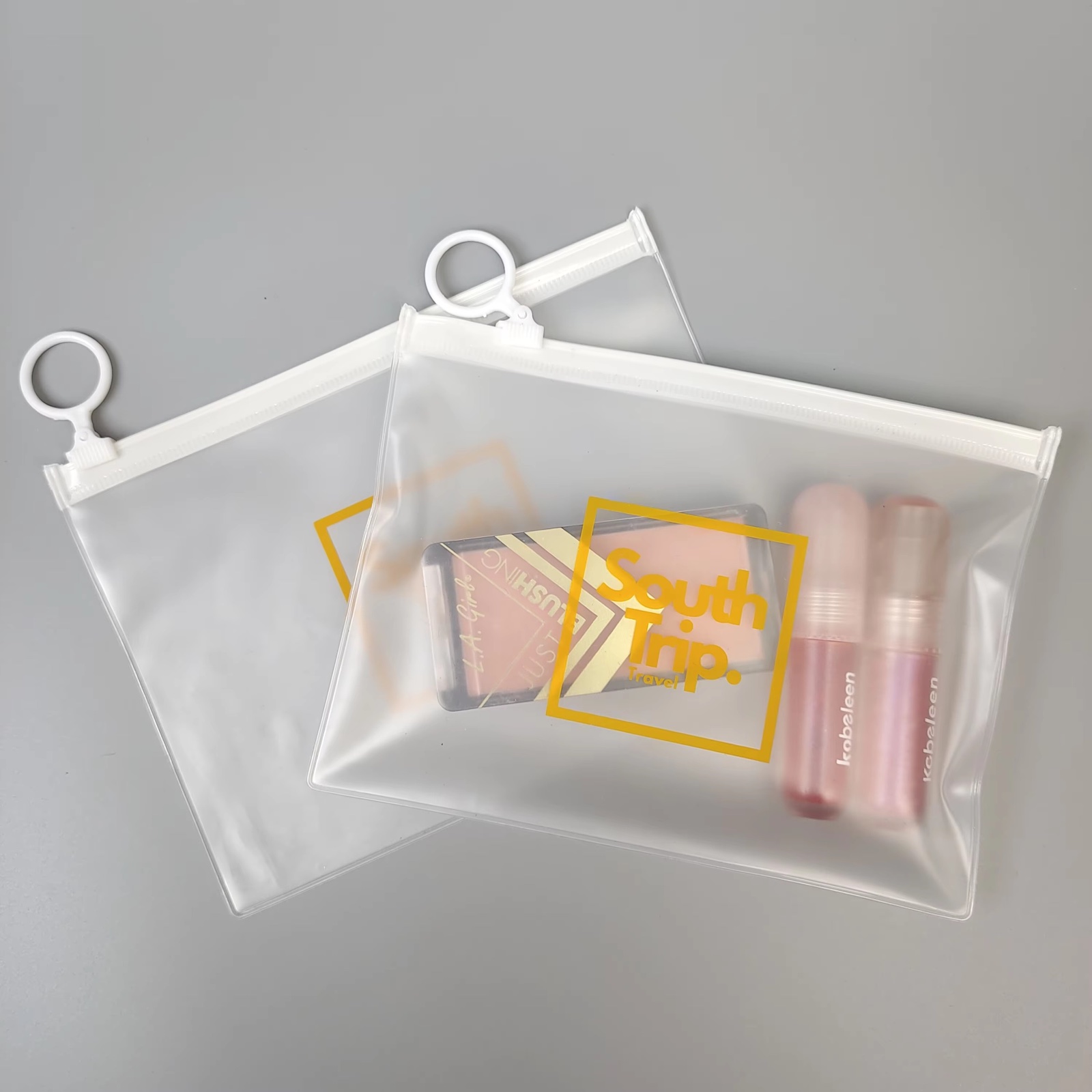 frosted PVC travel pouch with white zipper and circular ring pull - view 3