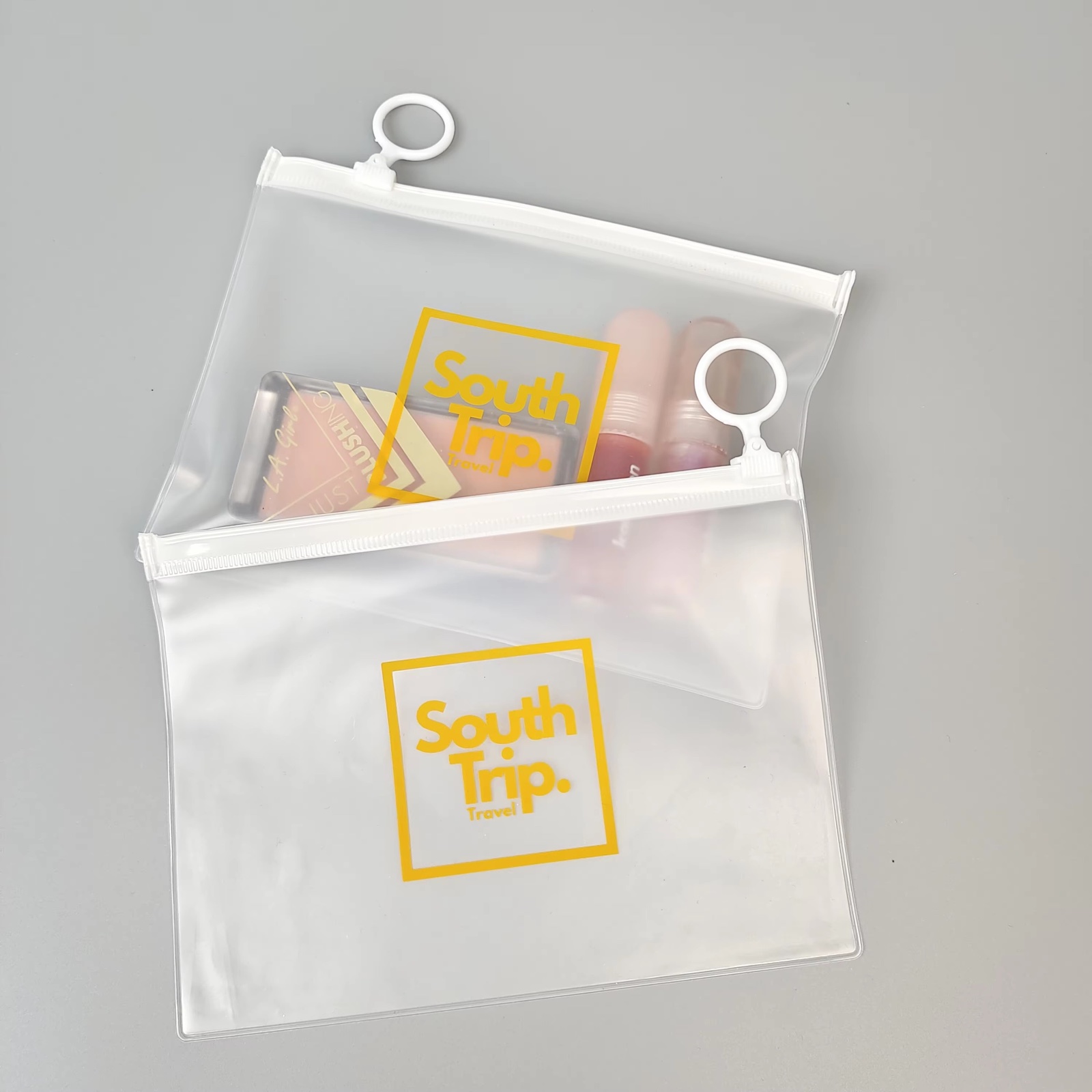 frosted PVC travel pouch with white zipper and circular ring pull - view 5