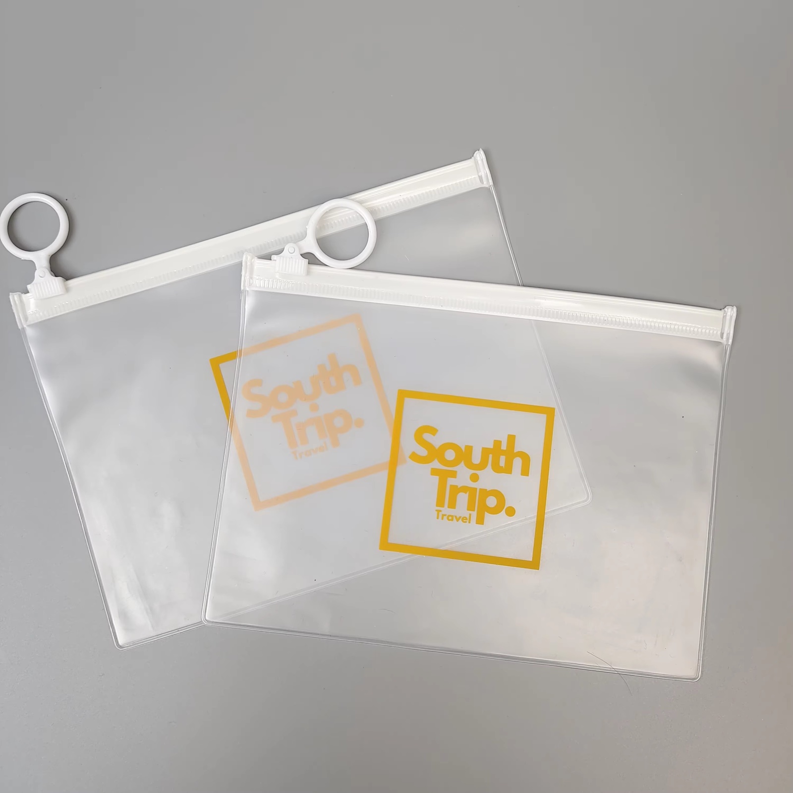 frosted PVC travel pouch with white zipper and circular ring pull - view 6