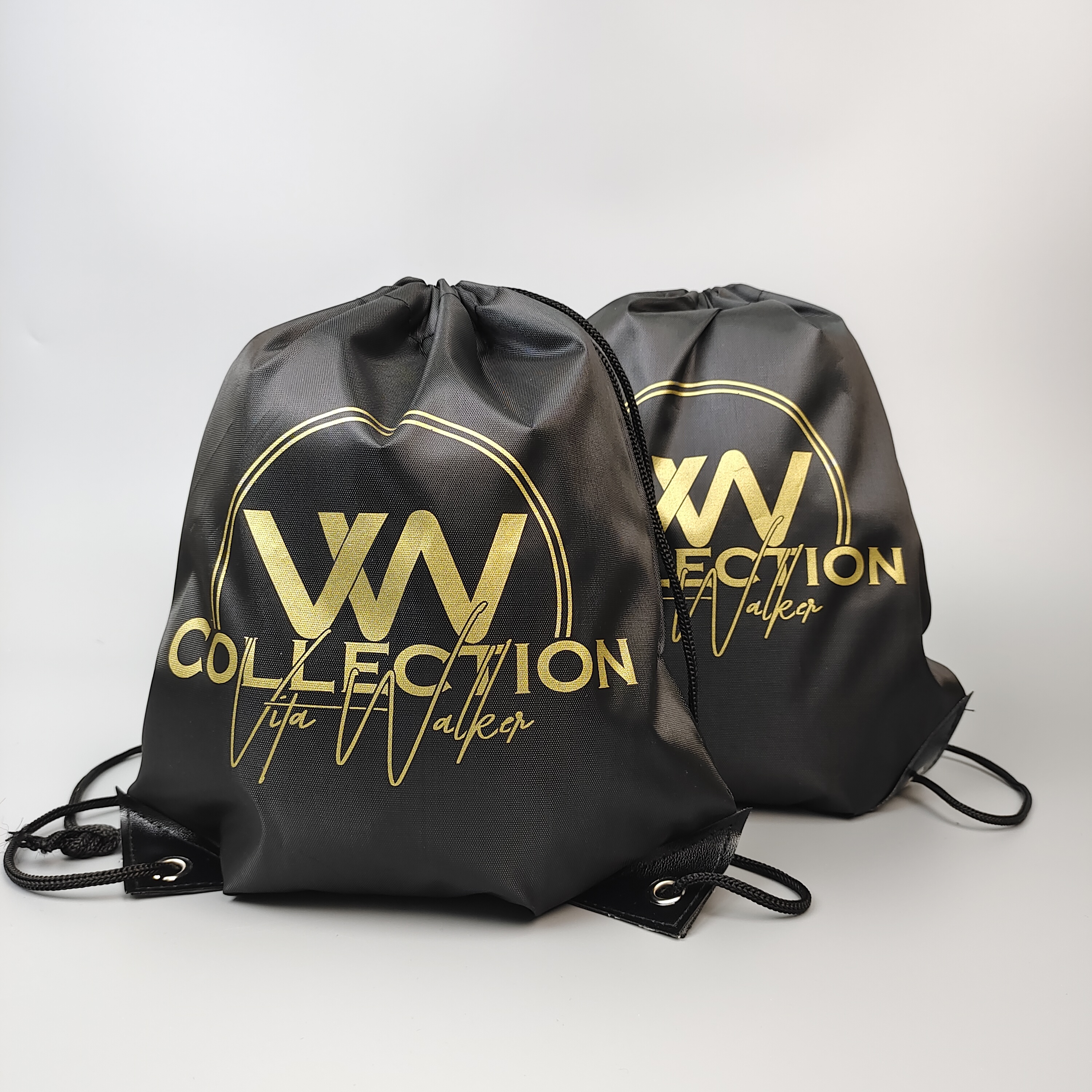 black polyester drawstring backpack with gold-colored logo artwork - view 3