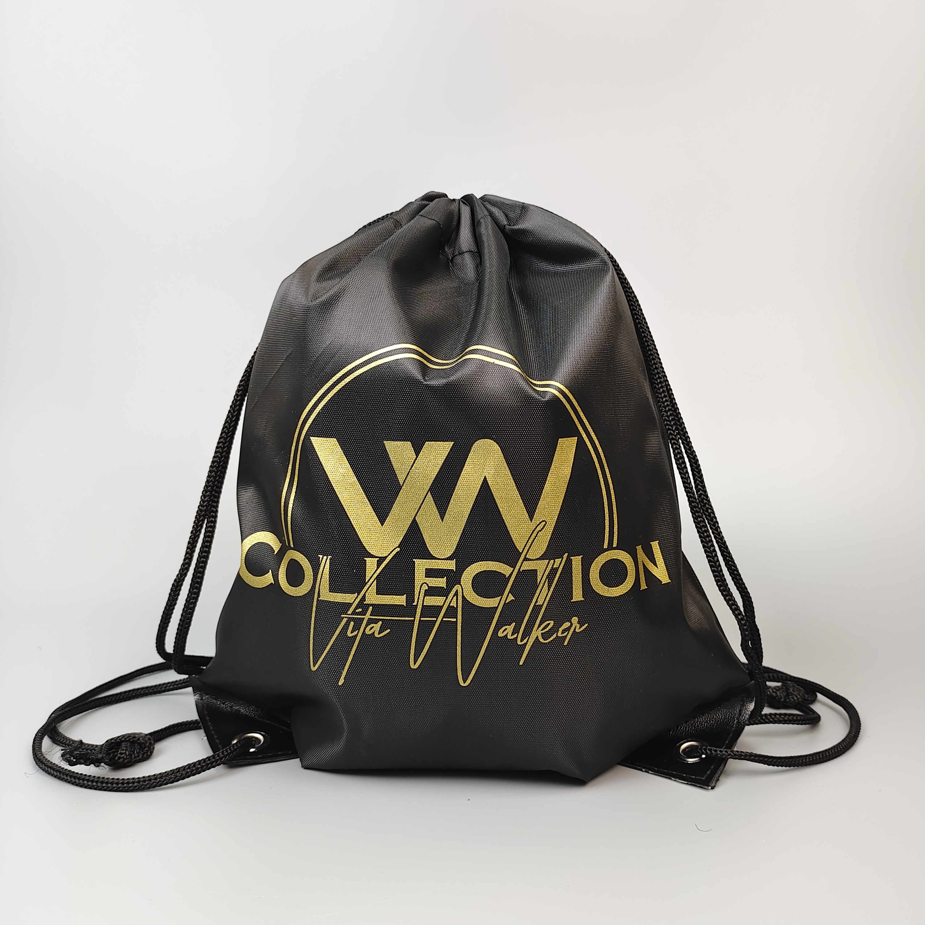 black polyester drawstring backpack with gold-colored logo artwork - view 4