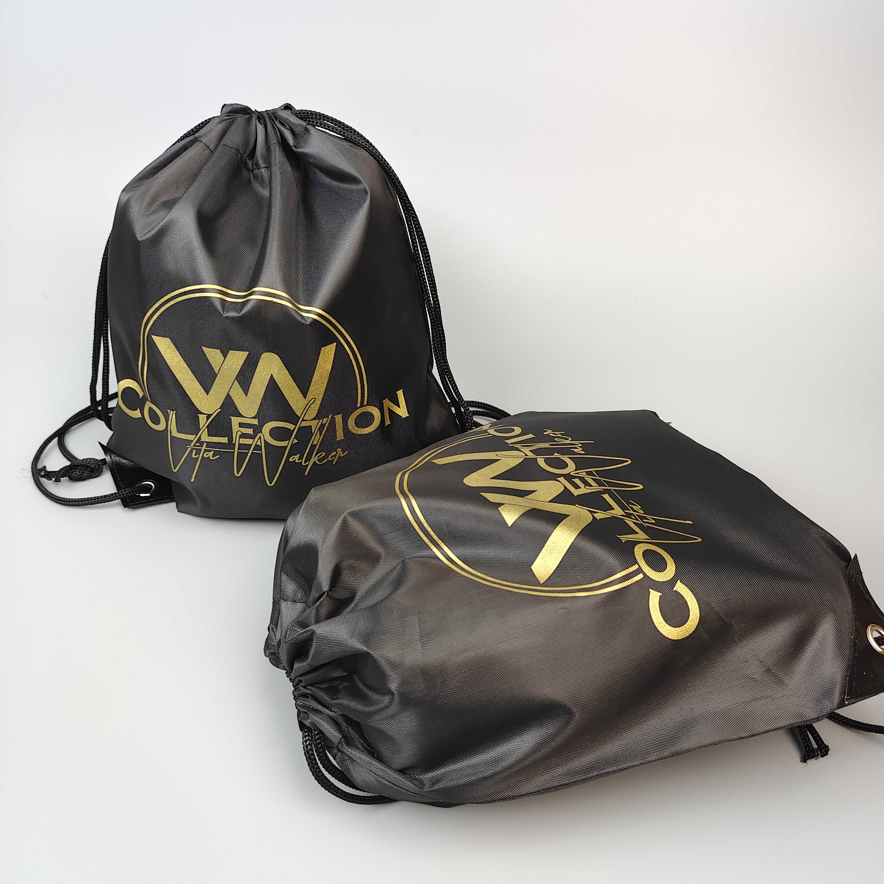 black polyester drawstring backpack with gold-colored logo artwork - view 5