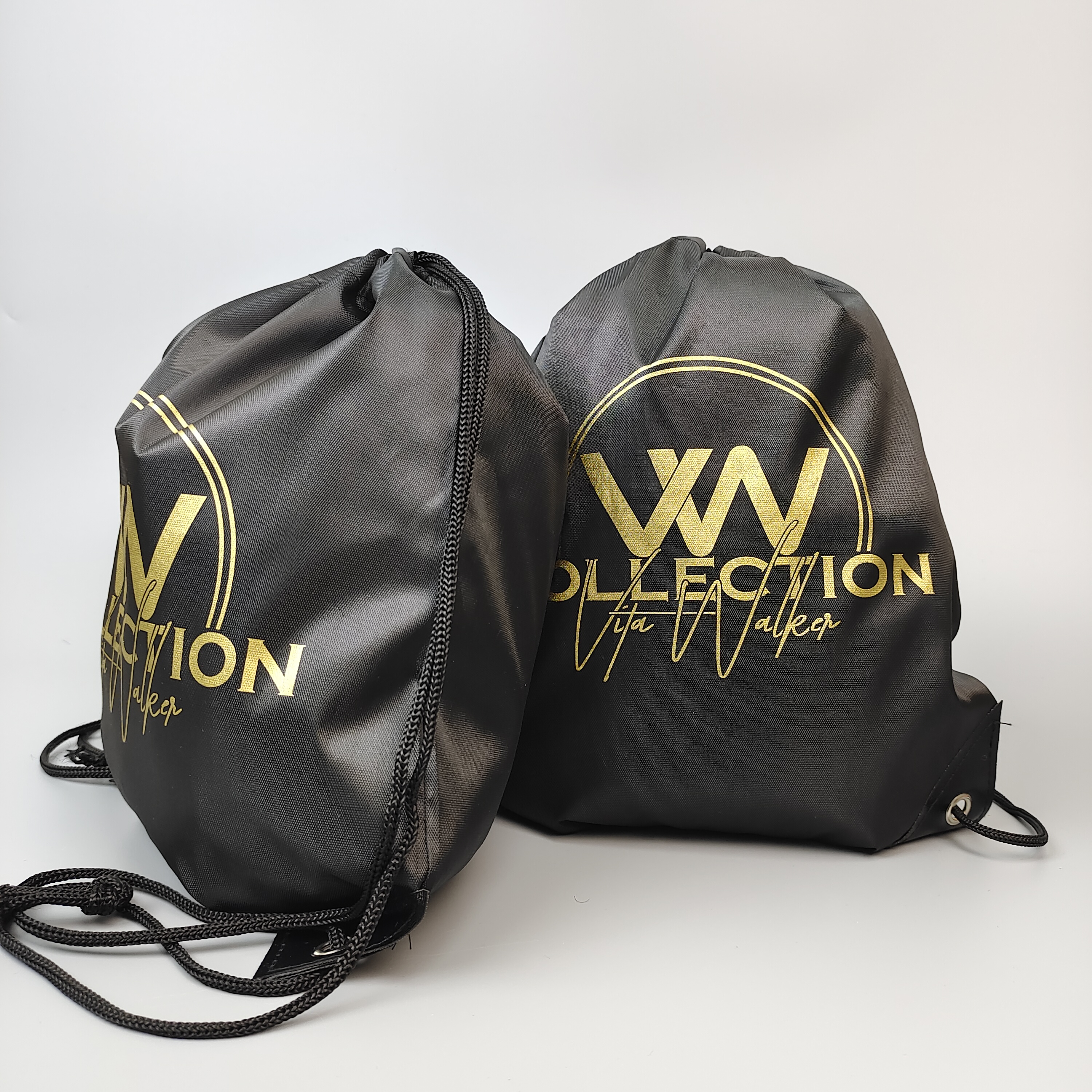 black polyester drawstring backpack with gold-colored logo artwork - view 6