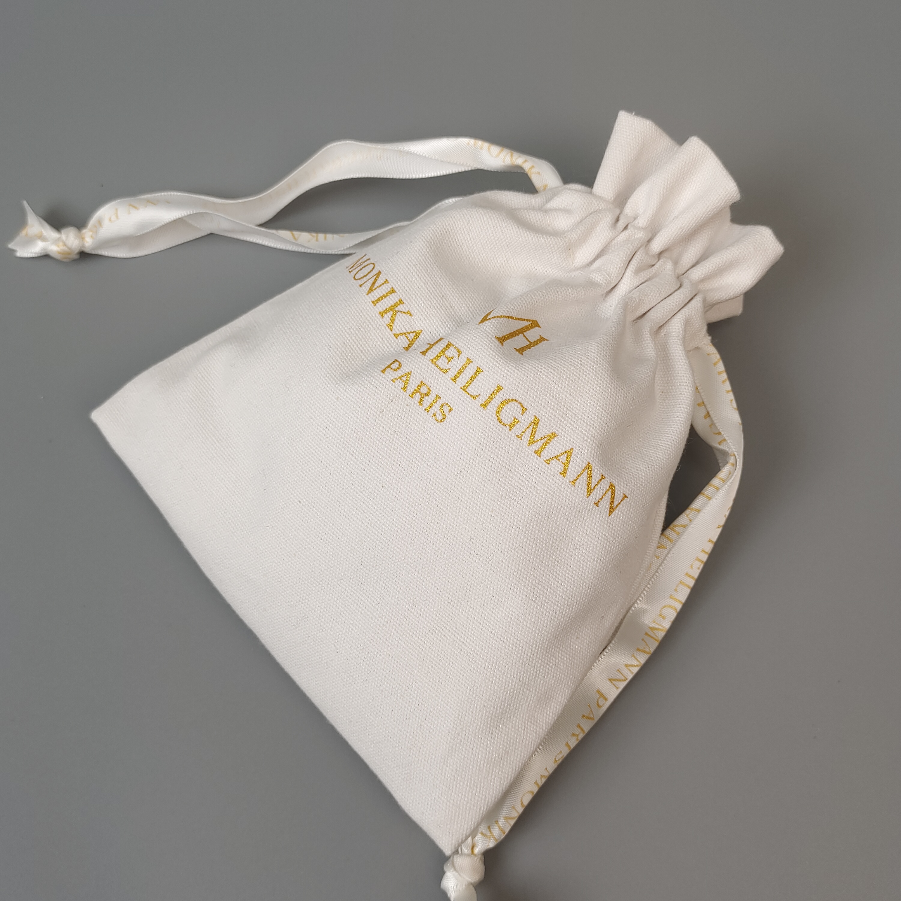 natural cotton drawstring pouch with metallic gold logo - view 2