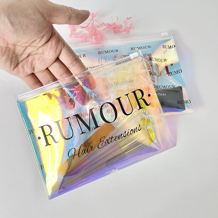 holographic PVC skincare pouch with white slider and black printed branding