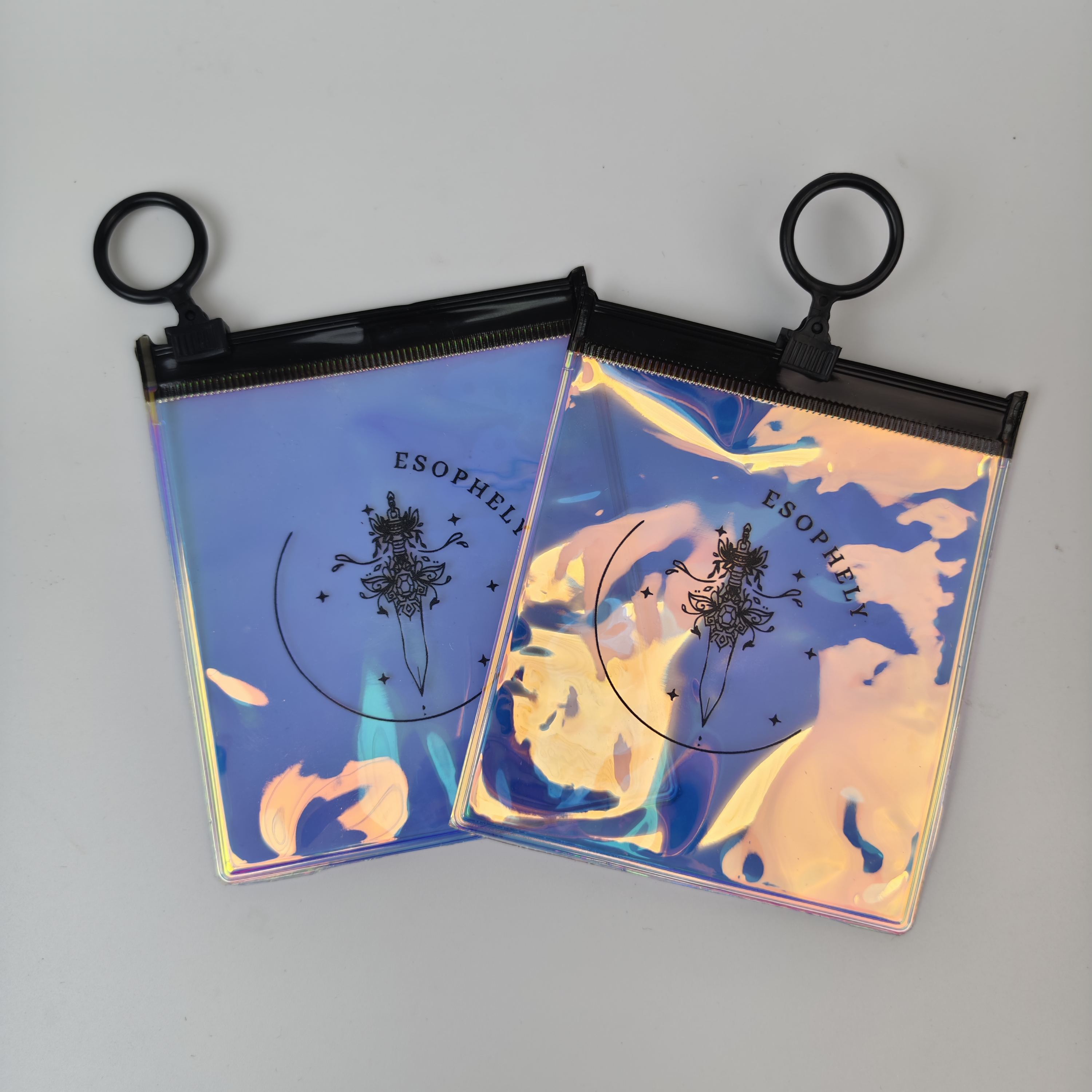 printed iridescent PVC zipper pouches with black ring pulls