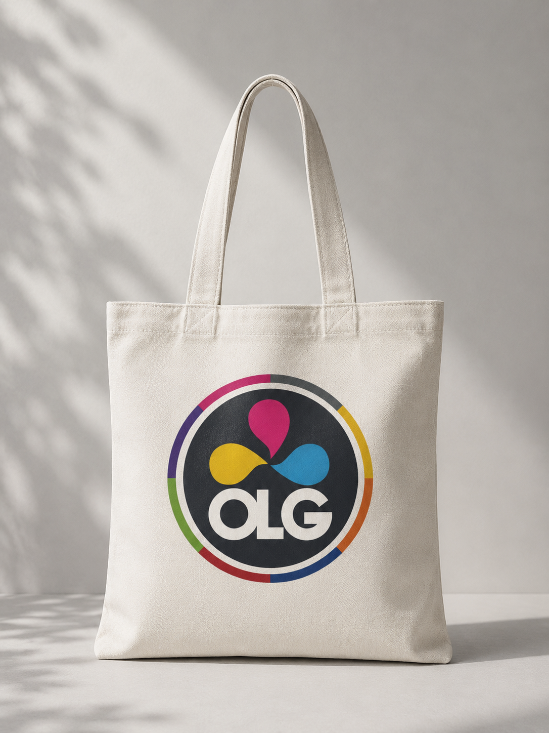 natural canvas tote bag with large circular multicolor logo
