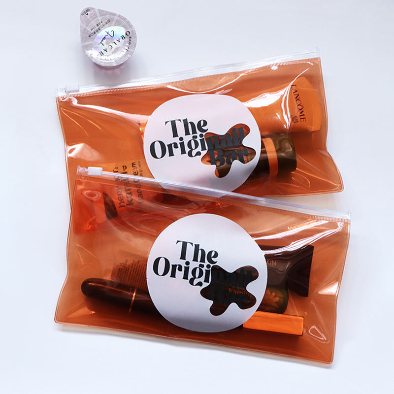 orange transparent PVC toiletry pouch set with white slider closures - view 2