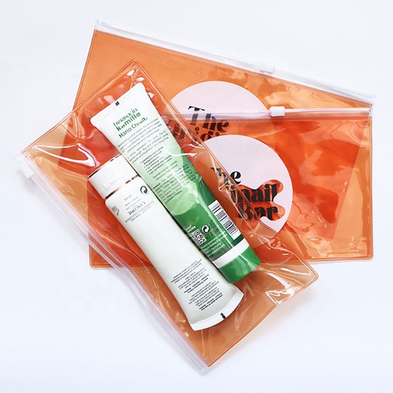 orange transparent PVC toiletry pouch set with white slider closures - view 3