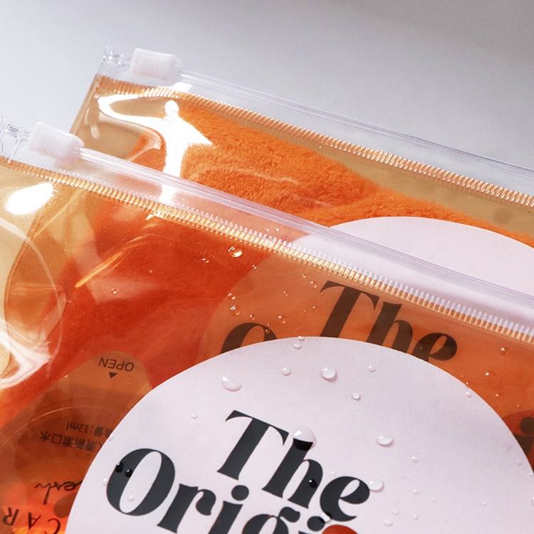 orange transparent PVC toiletry pouch set with white slider closures - view 5