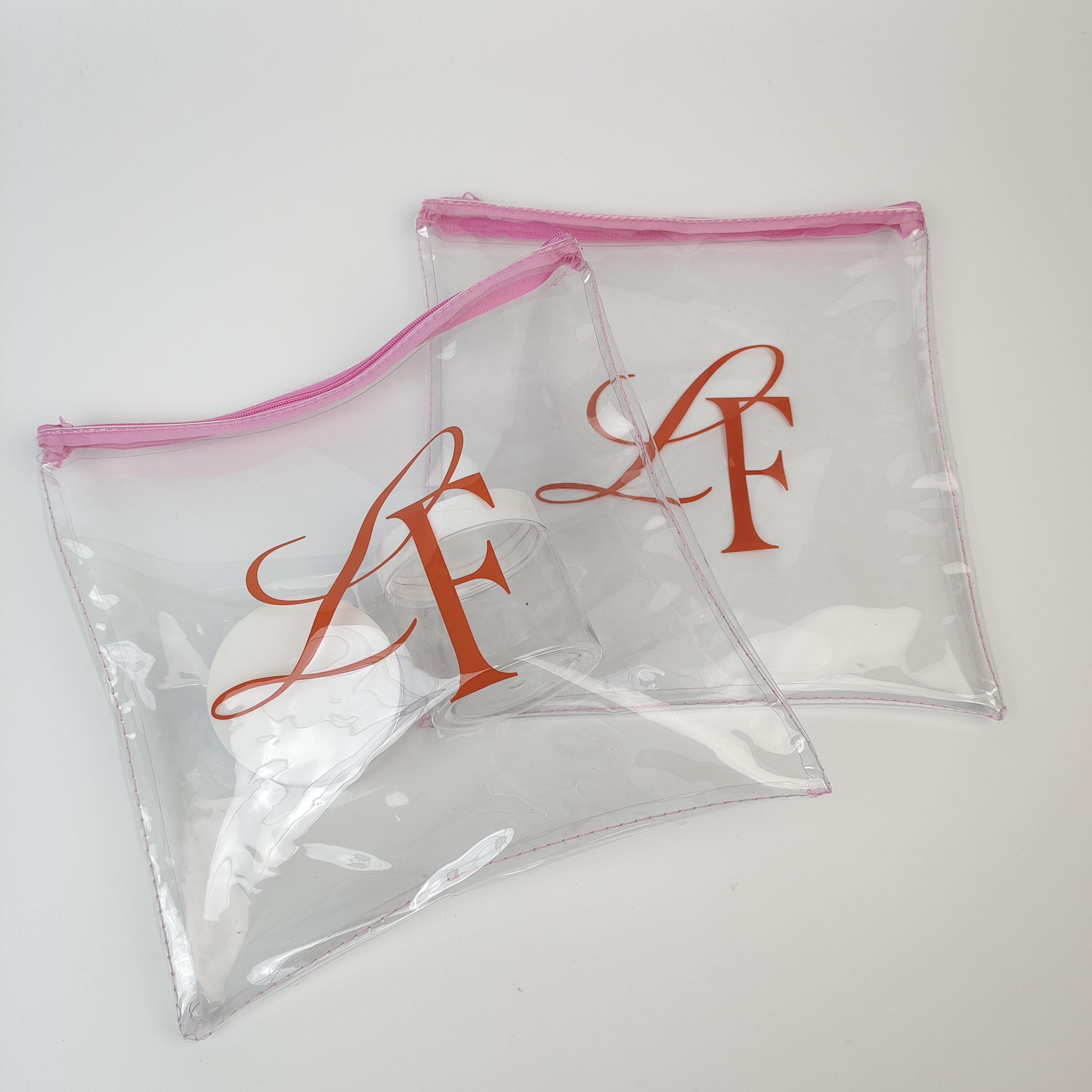 sewn clear PVC pouch with pink zipper and printed artwork - view 2