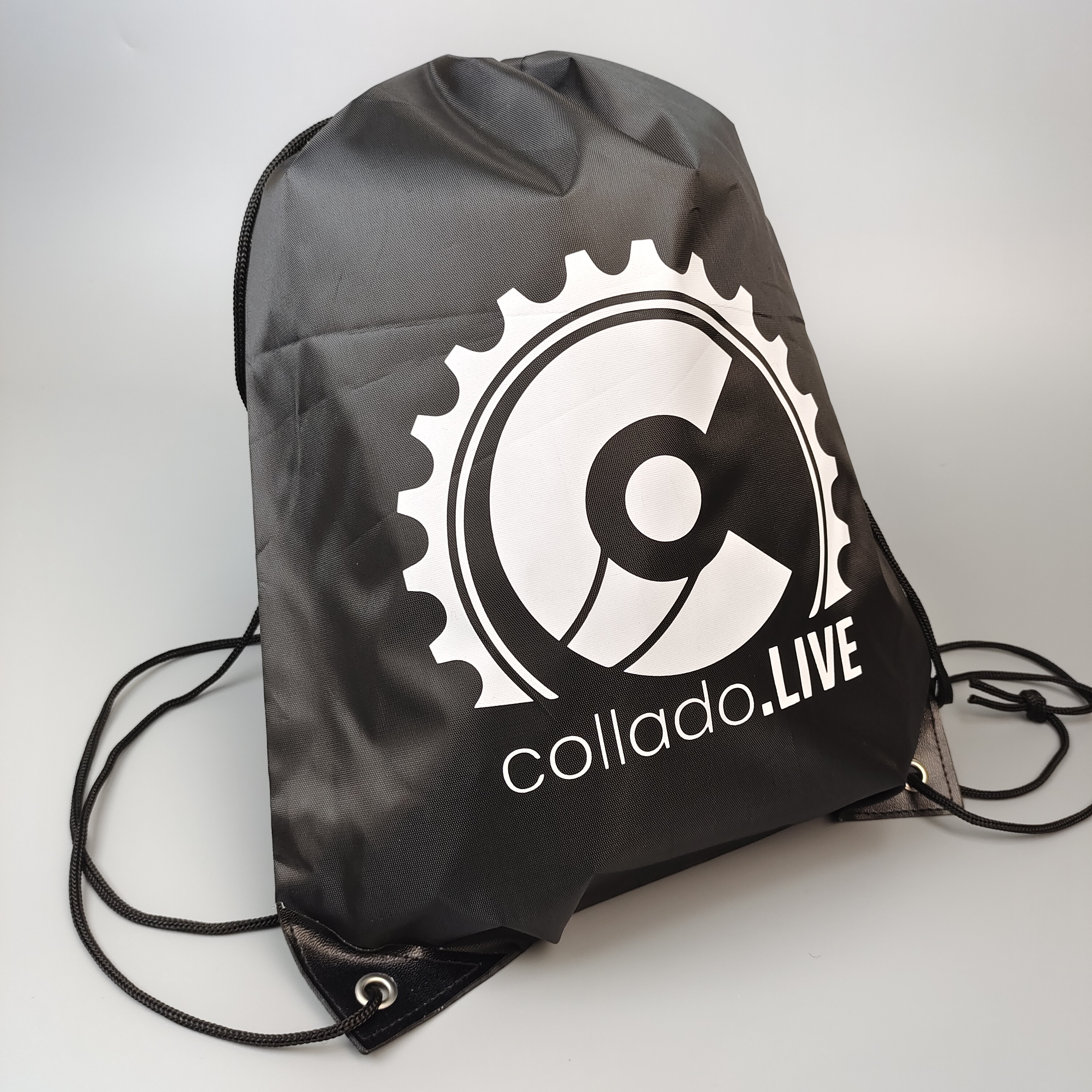 black polyester drawstring backpack with centered white emblem - view 2