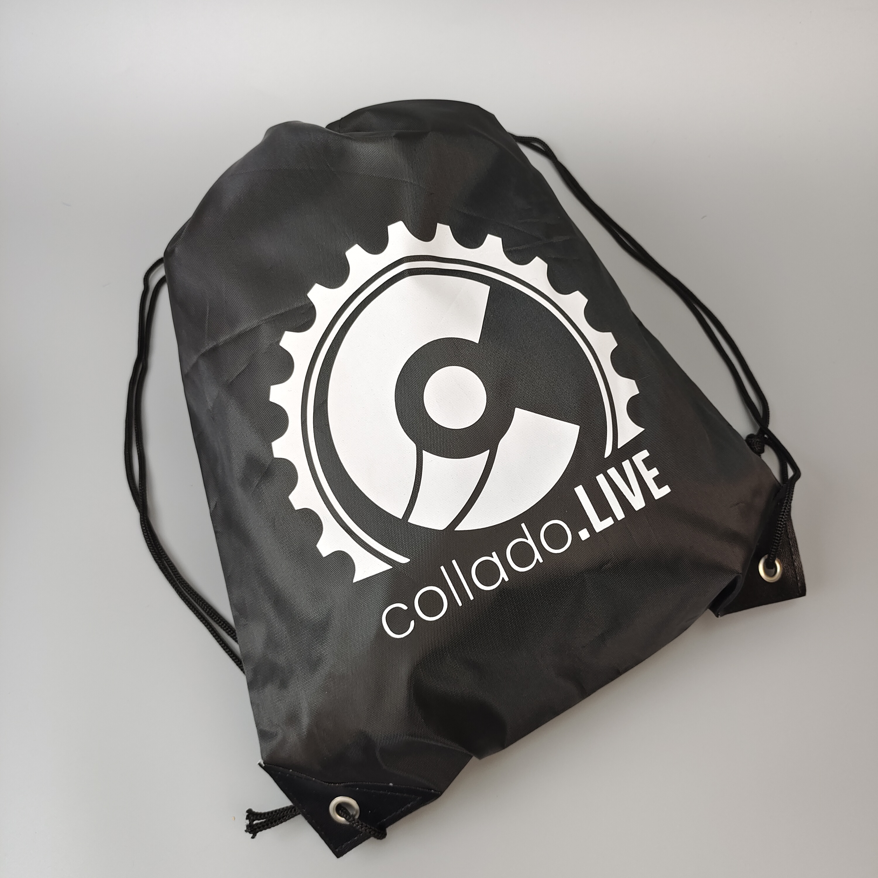 black polyester drawstring backpack with centered white emblem - view 4